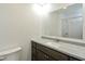 Bathroom featuring granite countertop and large mirror at 802 Lawrence Ave, Indianapolis, IN 46227