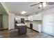 Modern kitchen with stainless steel appliances, gray backsplash, and a large island at 802 Lawrence Ave, Indianapolis, IN 46227