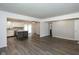 Spacious open-concept living room and kitchen, featuring modern flooring and neutral paint at 802 Lawrence Ave, Indianapolis, IN 46227
