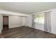 Bright living room with large windows, neutral walls, and modern flooring at 802 Lawrence Ave, Indianapolis, IN 46227