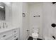 Renovated bathroom featuring black trim and a modern vanity at 8115 Englewood Rd, Indianapolis, IN 46240