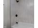 Modern bathroom featuring a shower and bathtub combination with black trim at 8115 Englewood Rd, Indianapolis, IN 46240