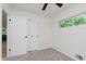 Carpeted bedroom featuring a closet and a window at 8115 Englewood Rd, Indianapolis, IN 46240