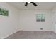 Carpeted bedroom featuring two windows and a closet at 8115 Englewood Rd, Indianapolis, IN 46240