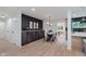 Cozy dining area with a dark accent wall, modern furnishings, and easy access to the kitchen and other living spaces at 8115 Englewood Rd, Indianapolis, IN 46240