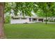 Lovely single-story home with brick accents, a lush green lawn, and a convenient attached two-car garage at 8115 Englewood Rd, Indianapolis, IN 46240