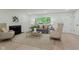 Bright living room features a neutral color palette, a large window, fireplace, and wood flooring at 8115 Englewood Rd, Indianapolis, IN 46240