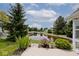 Scenic backyard with pond view and lush landscaping at 8247 Cape N Dr, Indianapolis, IN 46256