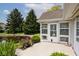Exterior view of the sunroom, patio, and pond at 8247 Cape N Dr, Indianapolis, IN 46256