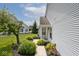 Landscaped front yard with sidewalk leading to a home featuring attractive siding at 8247 Cape N Dr, Indianapolis, IN 46256