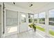 Bright sunroom with tile flooring and views of the pond at 8247 Cape N Dr, Indianapolis, IN 46256