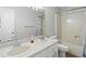 Well-lit bathroom featuring a double sink vanity, a toilet and shower at 8313 Tequista Cir, Indianapolis, IN 46236