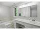 Clean Primary bathroom features a separate soaking tub and vanity with make up table at 8313 Tequista Cir, Indianapolis, IN 46236