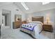 Bright bedroom with vaulted ceiling, skylights, large window, and a cozy rug at 8313 Tequista Cir, Indianapolis, IN 46236