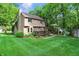 Charming two-story home with a well-maintained lawn and cozy backyard deck at 8313 Tequista Cir, Indianapolis, IN 46236