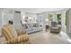 Comfortable living space featuring a view into an all-white kitchen with modern appliances at 8313 Tequista Cir, Indianapolis, IN 46236