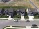 Aerial view of three modern homes in a suburban neighborhood with driveways and lawns at 8969 Faulkner Dr, Indianapolis, IN 46239