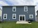 View of the home's backyard and light-blue siding at 8969 Faulkner Dr, Indianapolis, IN 46239