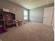 A view into the bedroom with a plush carpet and ample space at 8969 Faulkner Dr, Indianapolis, IN 46239