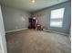 Bedroom showcasing neutral walls, plush carpet, and ample space at 8969 Faulkner Dr, Indianapolis, IN 46239