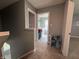 Upstairs hallway with views of the laundry room and the staircase at 8969 Faulkner Dr, Indianapolis, IN 46239