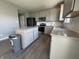 Modern kitchen featuring gray cabinets, stainless steel appliances, and granite countertops at 8969 Faulkner Dr, Indianapolis, IN 46239