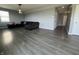 Living room featuring hardwood floors and a dark grey sofa at 8969 Faulkner Dr, Indianapolis, IN 46239