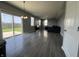 Spacious living room with sliding glass doors leading to a fenced backyard at 8969 Faulkner Dr, Indianapolis, IN 46239