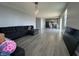 Bright living room with gray walls, wood floors, and a comfortable sofa at 8969 Faulkner Dr, Indianapolis, IN 46239