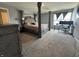 Large main bedroom with a four-poster bed and a home office setup at 8969 Faulkner Dr, Indianapolis, IN 46239