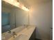 Bright bathroom featuring double vanity, a large mirror and modern fixtures at 9516 Bauhaus Way, Indianapolis, IN 46240