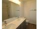 Contemporary bathroom featuring double sinks, modern fixtures, and a sleek design at 9516 Bauhaus Way, Indianapolis, IN 46240