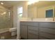 Well-lit bathroom featuring double vanity, a glass shower, and contemporary finishes at 9516 Bauhaus Way, Indianapolis, IN 46240