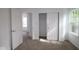 Bedroom with open doors, natural light, closet, and neutral carpet flooring throughout at 9516 Bauhaus Way, Indianapolis, IN 46240