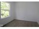 Bedroom featuring carpet floors, base trim, and a window at 9516 Bauhaus Way, Indianapolis, IN 46240