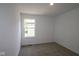 Well-lit bedroom with carpet floors and a single window at 9516 Bauhaus Way, Indianapolis, IN 46240