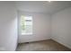 Bright bedroom with a window and neutral carpet flooring provides a cozy and comfortable space at 9516 Bauhaus Way, Indianapolis, IN 46240