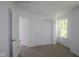 This bedroom is bright, with clean white walls, and has a double closet and neutral carpet at 9516 Bauhaus Way, Indianapolis, IN 46240