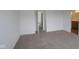 Main bedroom featuring carpet floors and entry into the bathroom at 9516 Bauhaus Way, Indianapolis, IN 46240