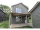 View of the home's exterior featuring a covered porch and neutral siding at 9520 Bauhaus Way, Indianapolis, IN 46240