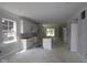 Spacious kitchen with white cabinets and large windows offers plenty of natural light at 9520 Bauhaus Way, Indianapolis, IN 46240