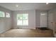 Living room with natural light from multiple windows at 9520 Bauhaus Way, Indianapolis, IN 46240
