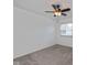Bright, neutral bedroom with ceiling fan and a window at 10016 Penrith Dr, Indianapolis, IN 46229