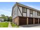 Two-story townhome with private garages, brick and siding exterior at 10016 Penrith Dr, Indianapolis, IN 46229