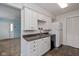 Well-lit kitchen with stainless steel appliances, white cabinetry, and an open layout at 10016 Penrith Dr, Indianapolis, IN 46229