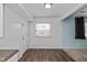 Kitchen nook with hardwood flooring, white trim, and plenty of natural light at 10016 Penrith Dr, Indianapolis, IN 46229