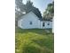 Lovely backyard with a lush green lawn and access to the home's back door at 1006 Hurricane St, Franklin, IN 46131