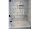 Bathroom shower with decorative tile and shower head at 1006 Hurricane St, Franklin, IN 46131