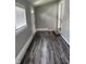 Entryway features modern gray flooring, neutral walls, and a bright window at 1006 Hurricane St, Franklin, IN 46131
