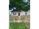 Quaint home featuring a rustic, wooden fence and a well-maintained lawn at 1006 Hurricane St, Franklin, IN 46131